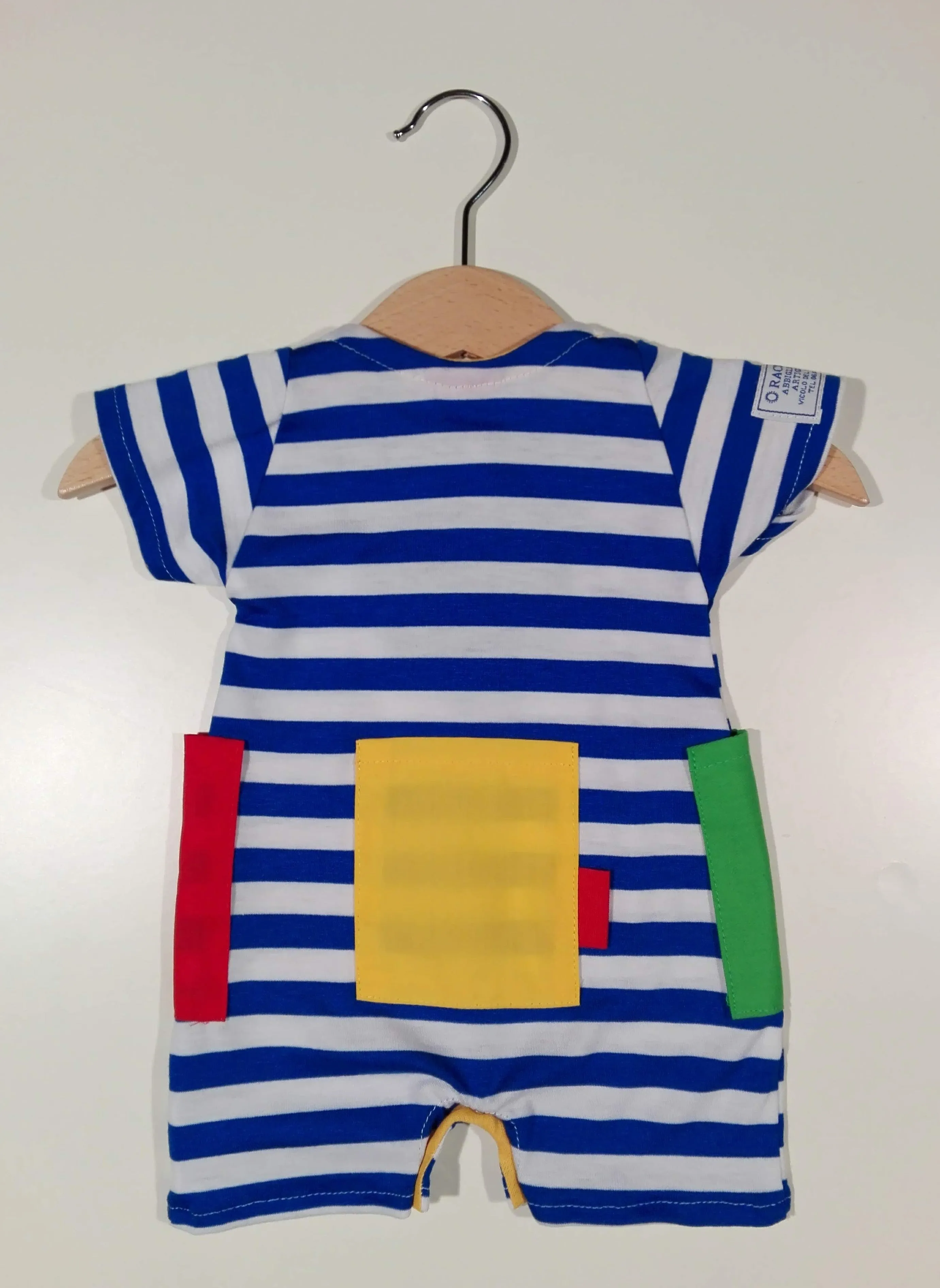 Short onesie in cotton with colored patches